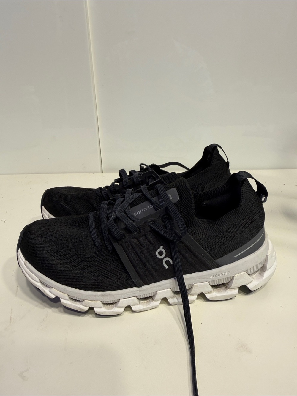 On Running Black and White Cloud Athletic Shoes